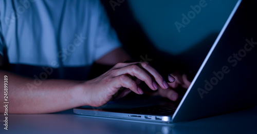 Close up programmer man hand typing on laptop for programming about cyber security , advance future technology concept	