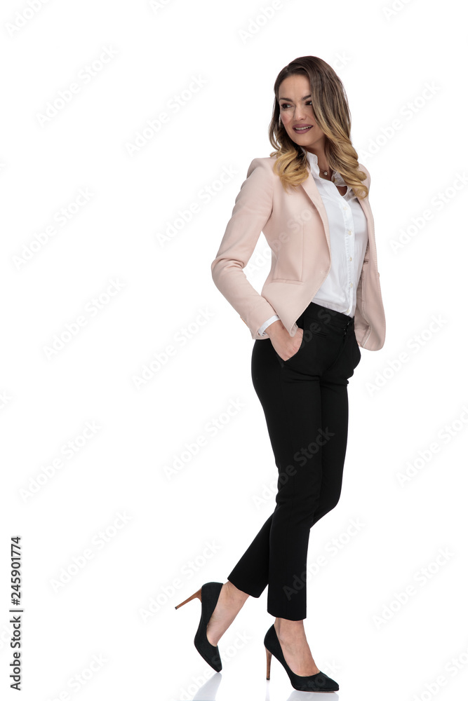 sexy smart casual woman posing and looking down to side sexy smart casual woman posing and looking down to side
