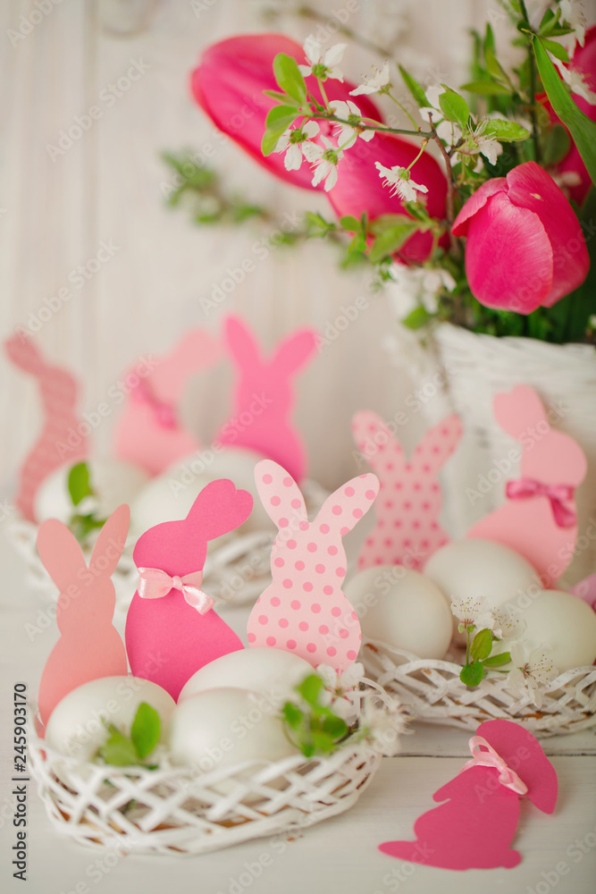 Happy easter. Decor of Easter eggs in small white baskets. Happy easter. Decor of Easter eggs in small white baskets.