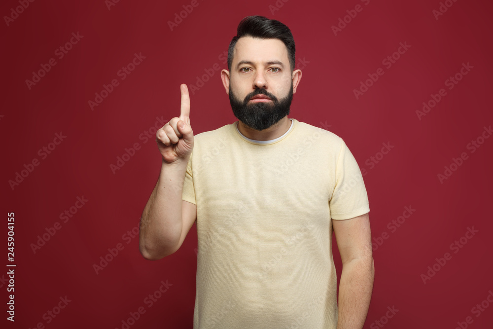 a young pretty cute brunette with a beard showing on her fingers one a young pretty cute brunette with a beard showing on her fingers one