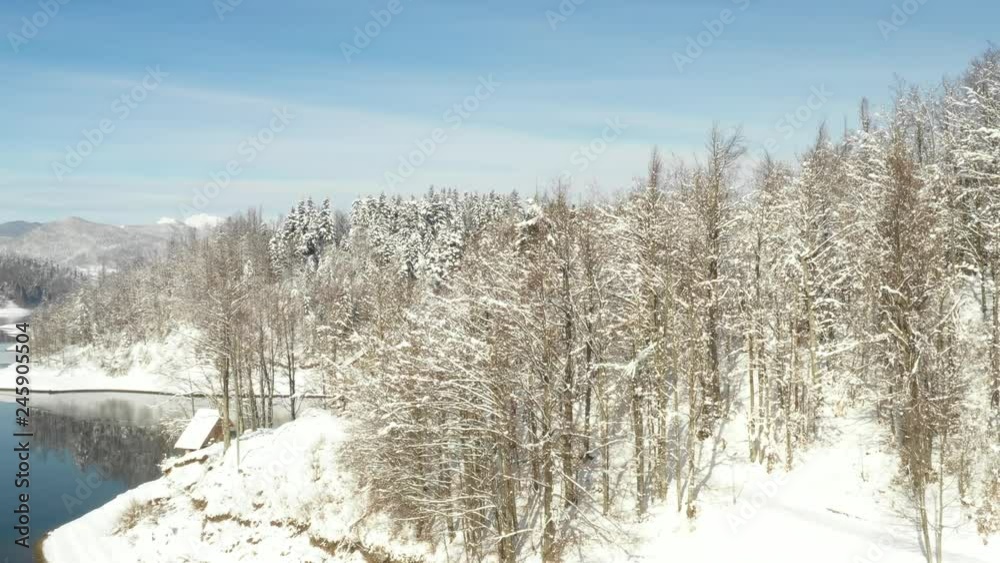 Beautiful winter panorama, drone video of Lokvarsko lake and Risnjak mountain in Gorski kotar, Croatia, reveal shot Beautiful winter panorama, drone video of Lokvarsko lake and Risnjak mountain in Gorski kotar, Croatia, reveal shot