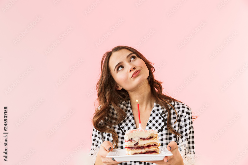 Beautiful young woman standing isolated over pink Beautiful young woman standing isolated over pink