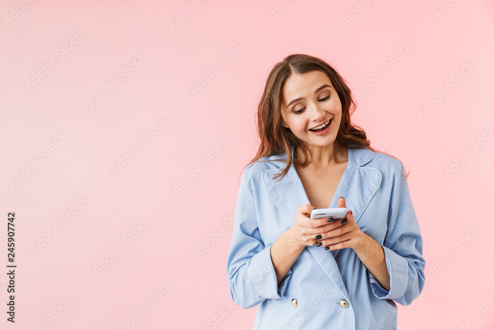 Beautiful young woman wearing pajamas standing Beautiful young woman wearing pajamas standing