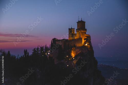 panoramic view of ancient medieval San Marino fortress on a winter sunset with few clouds