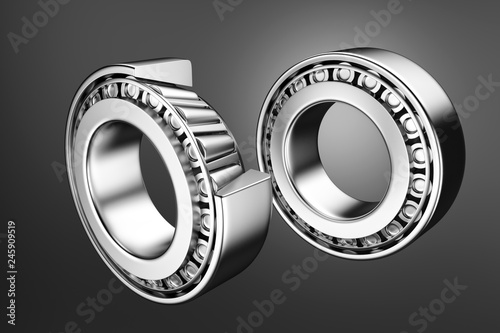 3D rendering. Automotive bearings auto spare parts. Tapered roller bearing isolated on a dark background. Wheel bearing for truck, heavy duty and car.
