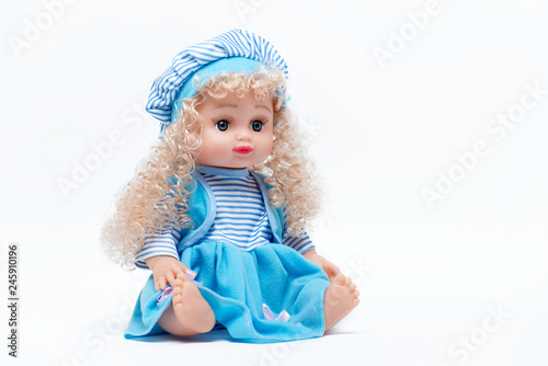  Doll with blond hair in a blue dress and hat