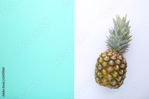 Ripe pineapple on a colorful background