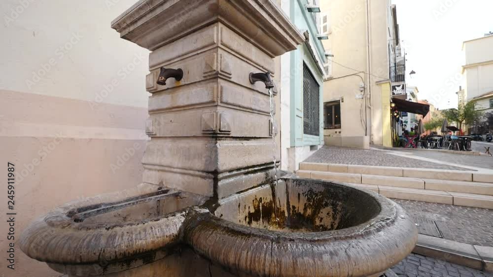 Street monument faucet with water in Cannes France Street monument faucet with water in Cannes France
