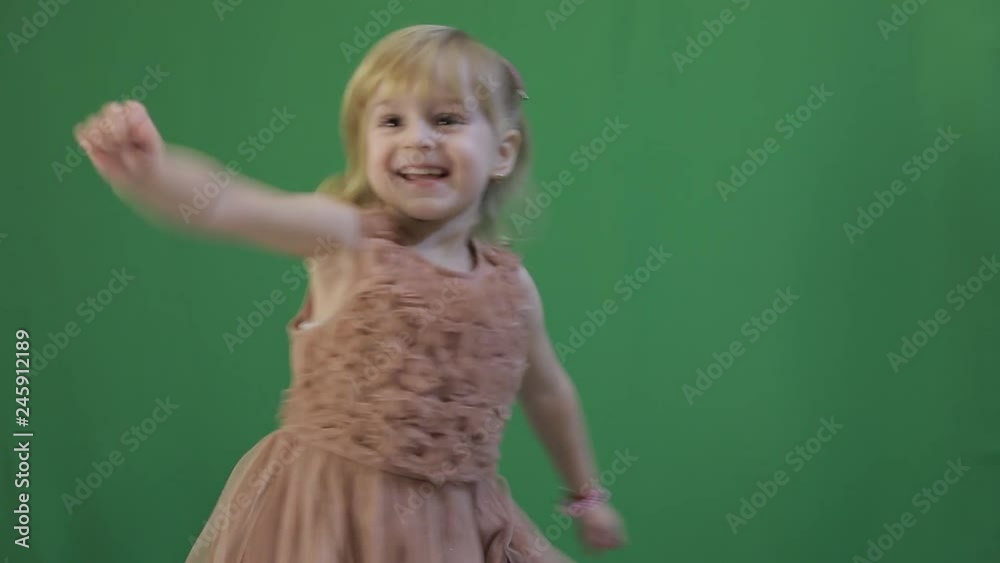 Happy three years old girl. Cute blonde child. Brown eyes. Green screen video Happy three years old girl. Cute blonde child. Brown eyes. Green screen video