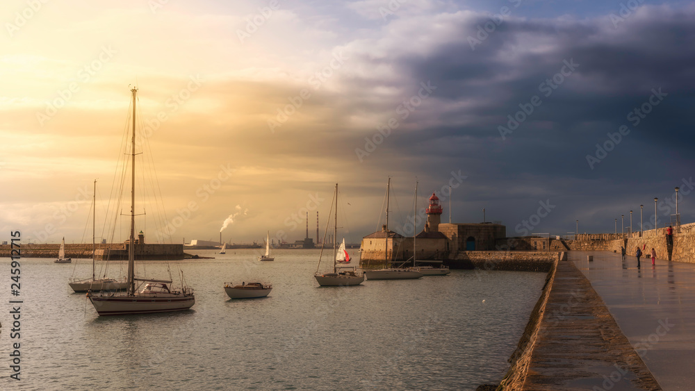 Sunset stroll in Dun Laoghaire pier, Ireland Sunset stroll in Dun Laoghaire pier, Ireland