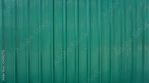 Green metal sheet wall.