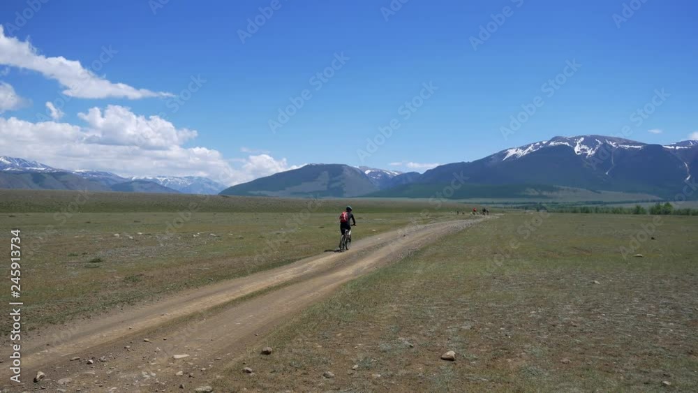 Mountain bikers in mountains of Altay Mountain bikers in mountains of Altay