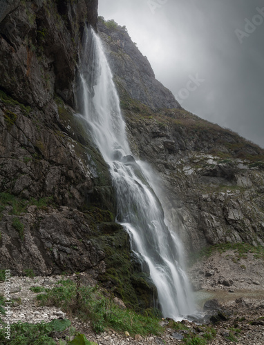 water flows from the waterfall flowing down the rock