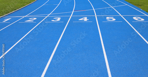 Fototapeta Naklejka Na Ścianę i Meble -  lanes of a athletic track with numbers one two three four five s