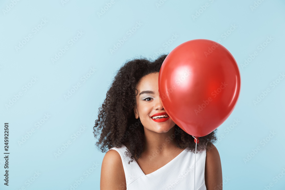 Cheerful young african woman wearing dress Cheerful young african woman wearing dress