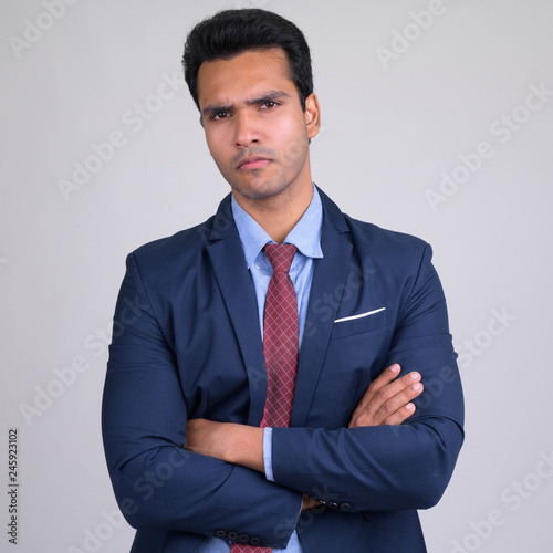 Portrait of young Indian businessman with arms crossed