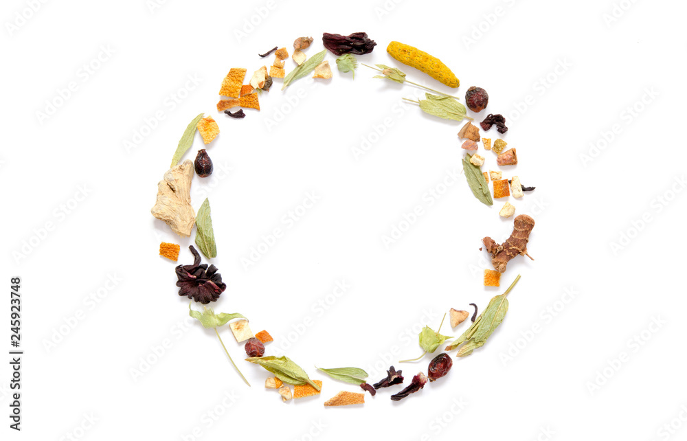 Obraz premium Frame with herbal tea, dry herbs and flowers with pieces of fruit and berries. Top view. Copy space