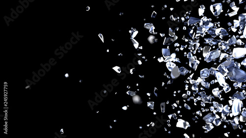Particles and fragments of glass or crystals on a black background