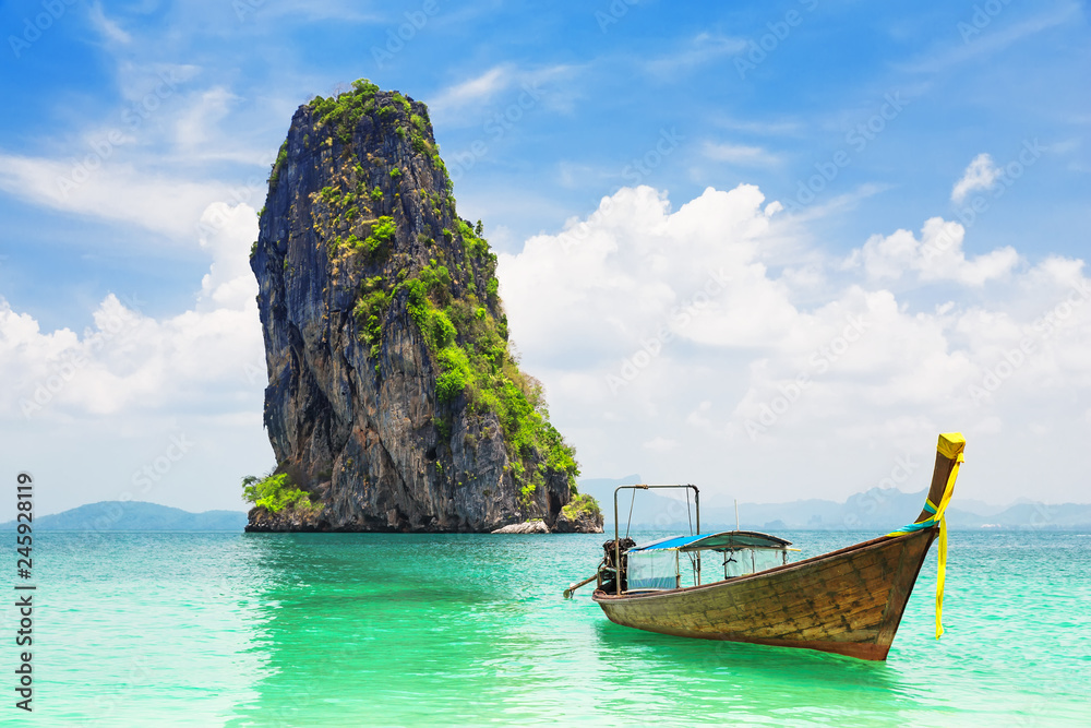 Thai traditional longtail boat and beautiful sand beach Thai traditional longtail boat and beautiful sand beach