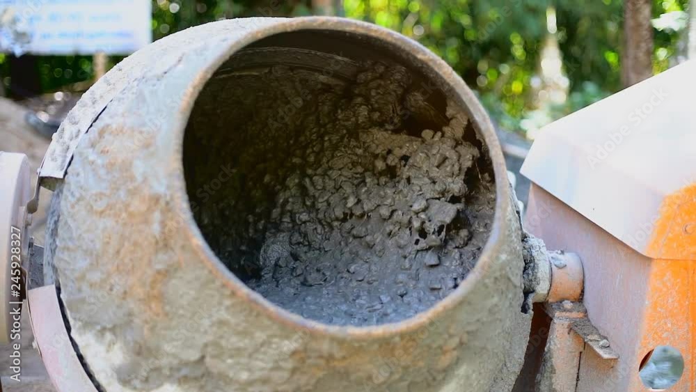 Concrete Mixer Mixing Mortar on Construction Sites and Kneading Concrete. Concrete Mixer Mixing Mortar on Construction Sites and Kneading Concrete.