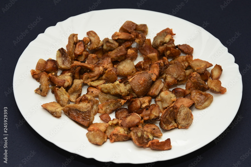 mushrooms fried on a white plate