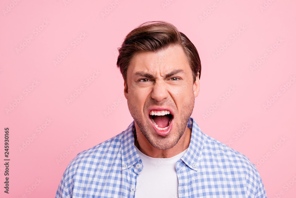 Close up photo of attractive but outraged he him his man mouth grinning screaming on epic fail of favorite team wearing casual shirt outfit isolated on pale rose background Close up photo of attractive but outraged he him his man mouth grinning screaming on epic fail of favorite team wearing casual shirt outfit isolated on pale rose background