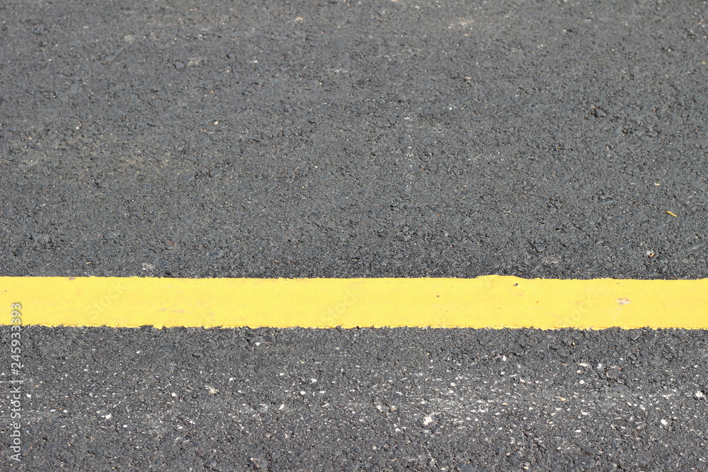 Fototapeta premium Asphalt texture with road markings background
