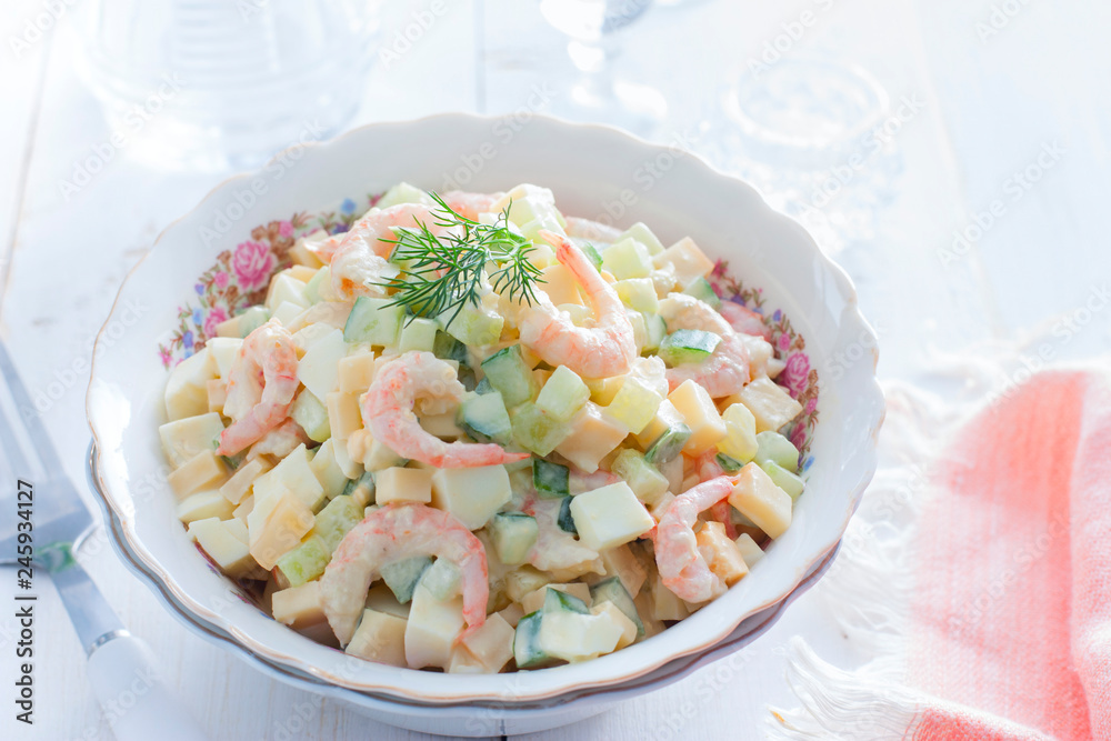 Salad with shrimps, cucumber, eggs and cheese, horizontal Salad with shrimps, cucumber, eggs and cheese, horizontal