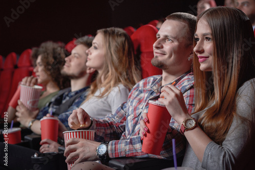 Students watching movie in modern cinema hall
