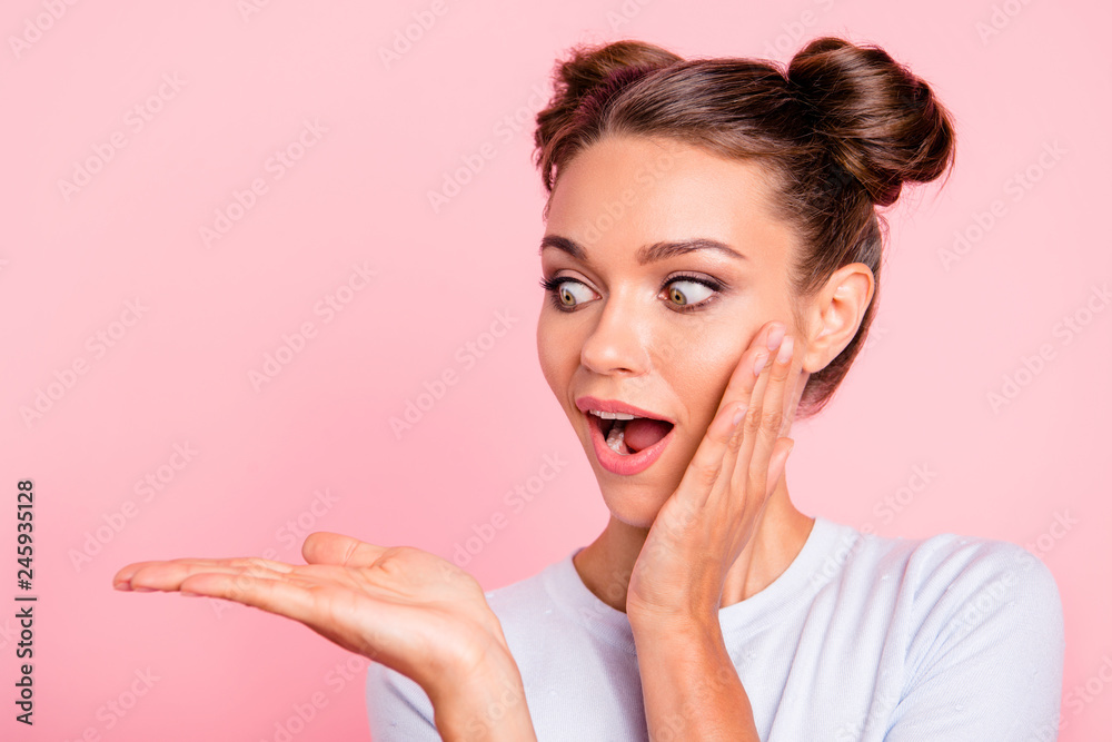 Close-up portrait of her she nice attractive winsome cheerful shocked girl lady holding looking at object on palm isolated over pastel pink background - obrazy, fototapety, plakaty 