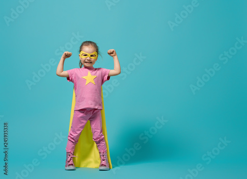 child playing superhero