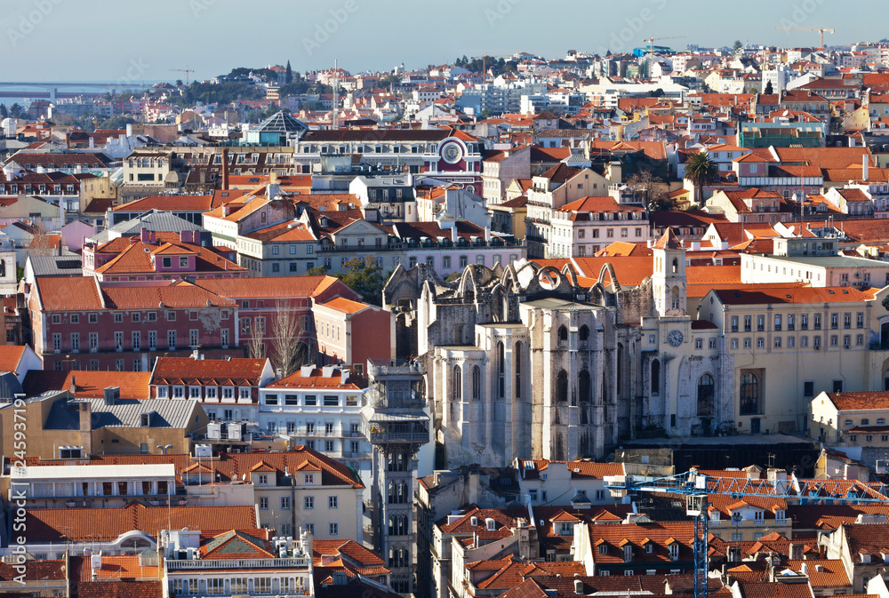 Lisbon. Top view on the historic city center, the ruins of the monastery of Carmo and the carved metal lift of Santa Justa from the observation deck from the fortress Saint George