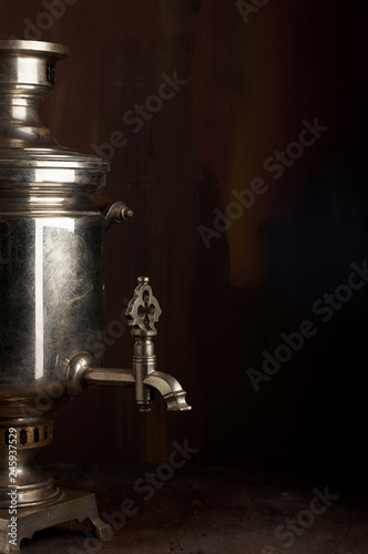 A traditional vintage water boiler pot for tea Russian Samovar