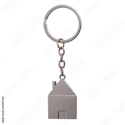 Silver house shaped keychain with keyring isolated on white background with copy space. Concepts for real estate and moving home or renting property.