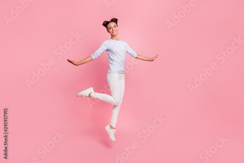 Full length body size view portrait of her she nice adorable lovely attractive winsome pretty cheerful dreamy girl walking enjoying life time isolated over pink pastel background