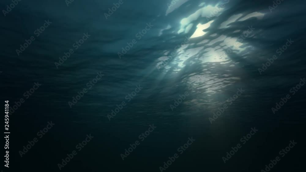 Under water ocean waves and sun light. Seamless loop 