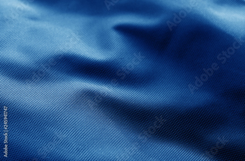Textile texture with blur effect in navy blue color.