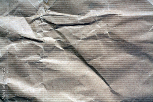 Brown color crumpled sheet of paper. photo