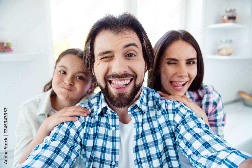 Self-portrait of nice cute sweet lovely attractive trendy cheerful cheery childish positive people mom dad rejoicing spending time having fun in light white modern interior indoors Self-portrait of nice cute sweet lovely attractive trendy cheerful cheery childish positive people mom dad rejoicing spending time having fun in light white modern interior indoors
