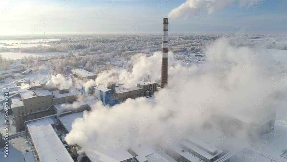Smoke rising from cellulose factory aerial view
