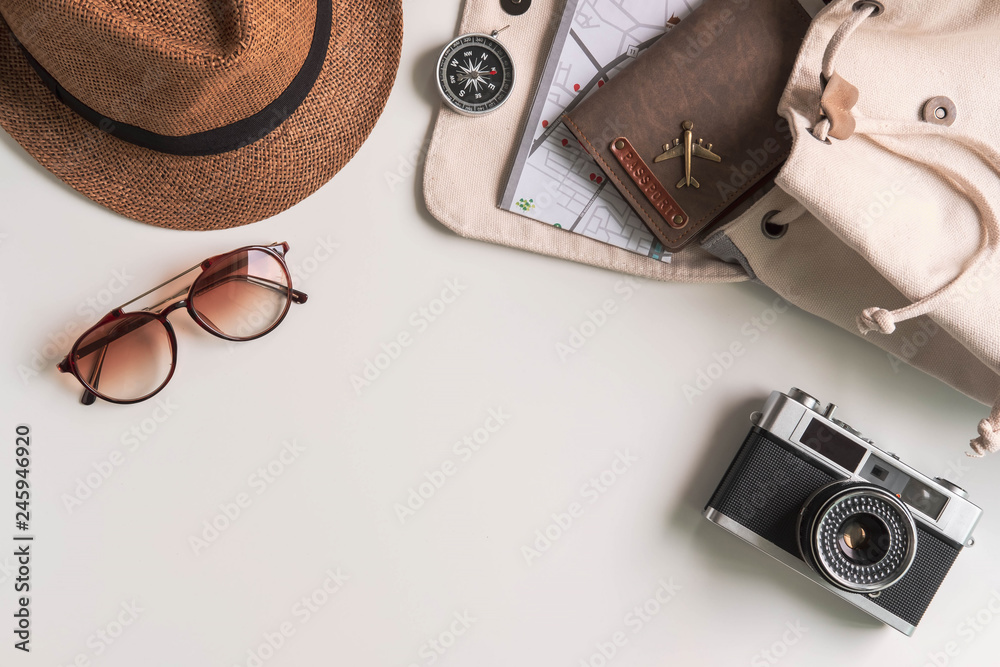 Retro camera with travel accessories and items on white background with copy space, Travel concept - obrazy, fototapety, plakaty 