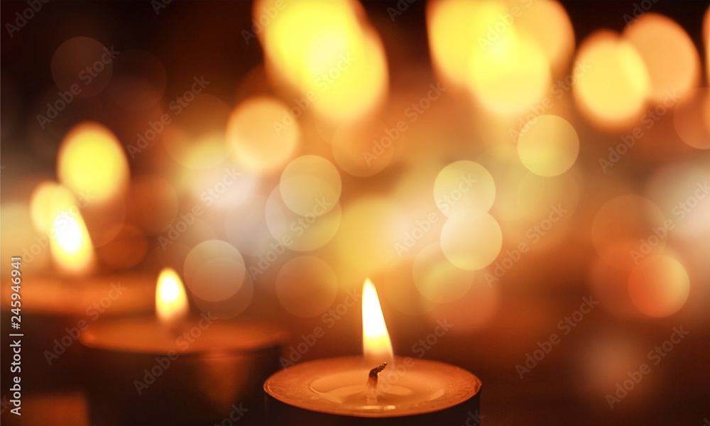 Close up view of the candles cutting through the darkness. Close up view of the candles cutting through the darkness.