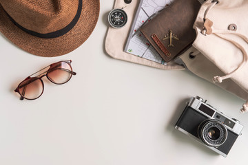 Retro camera with travel accessories and items on white background with copy space, Travel concept