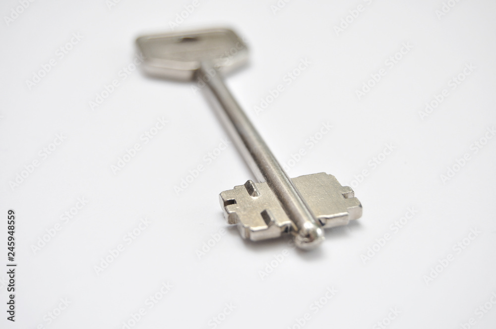 Door key on white backgroundDoor key on white background Door key on white backgroundDoor key on white background