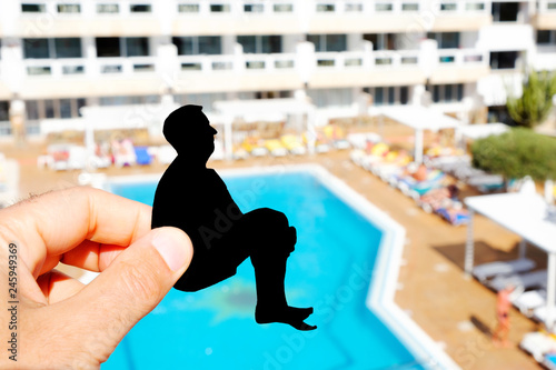 фотографія silhouette of a man throwing himself into a pool