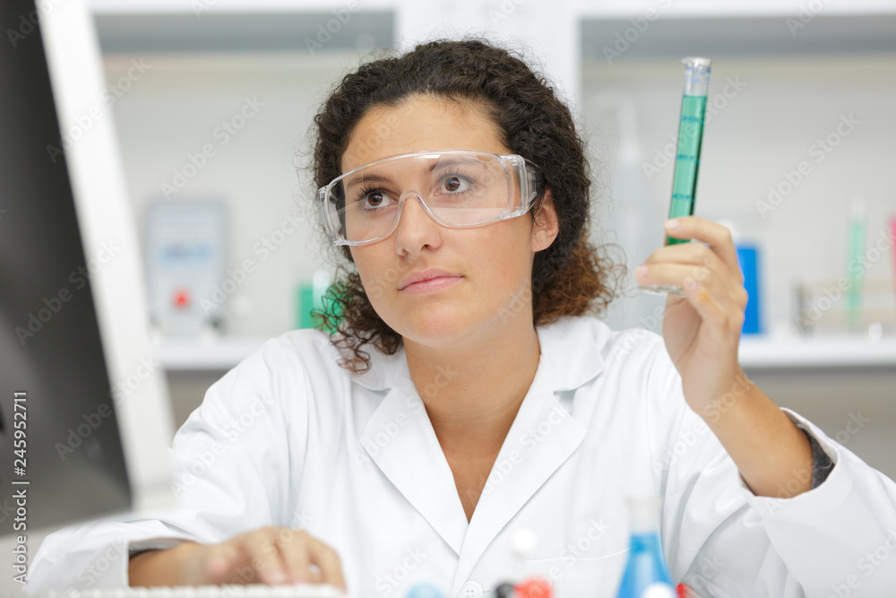 woman with pipette with liquids inside woman with pipette with liquids inside