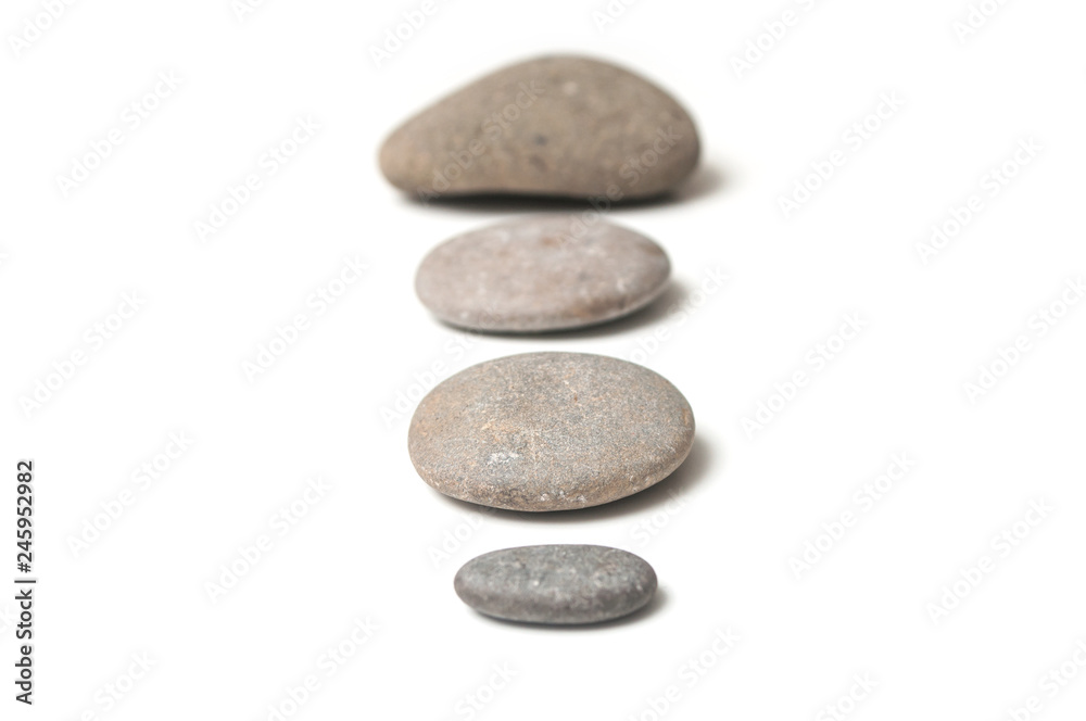 closeup of stone alignment on white background closeup of stone alignment on white background