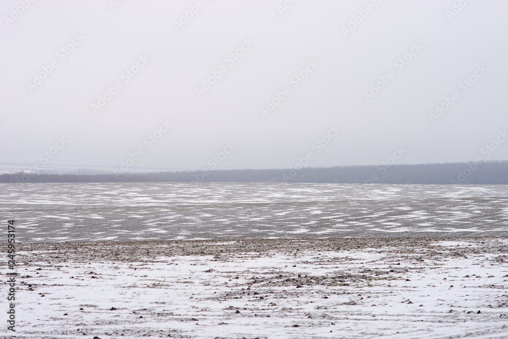 Land field covered in frost in the onset of early winter Land field covered in frost in the onset of early winter
