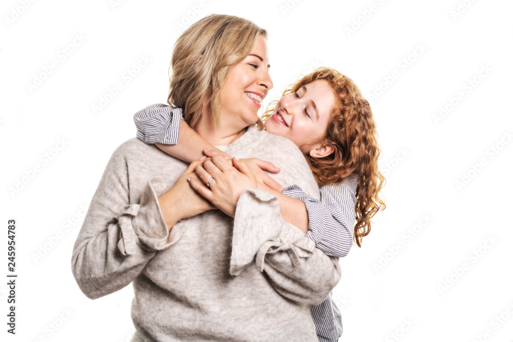 Beautiful readhead girl with on studio white background with her mother Beautiful readhead girl with on studio white background with her mother