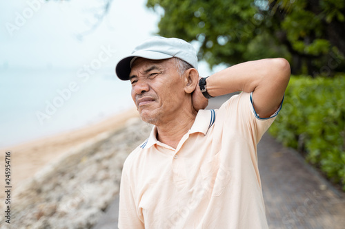 senior male having neck pain